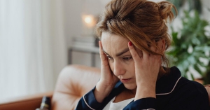 Stressed Girl holding forehead